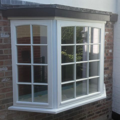 White timber bay windows