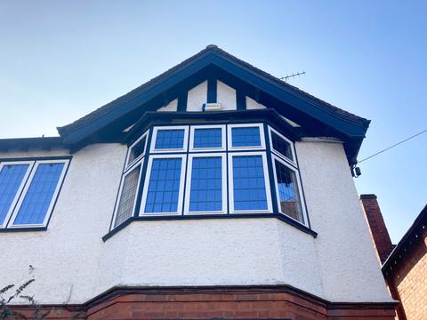 First floor timber leaded bay window