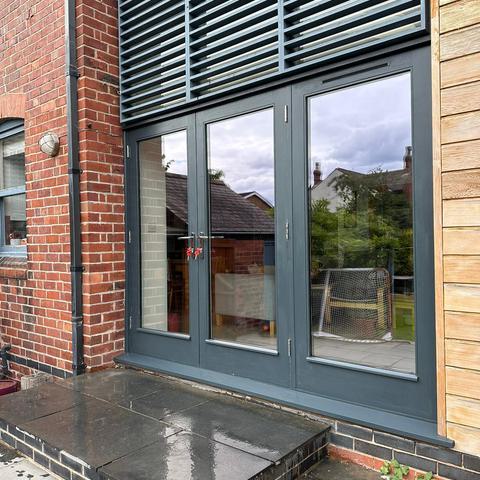 Modern Timber Bi-fold Door with Fanlight