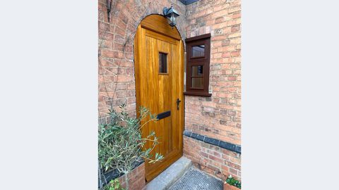 Oak front door with black handle